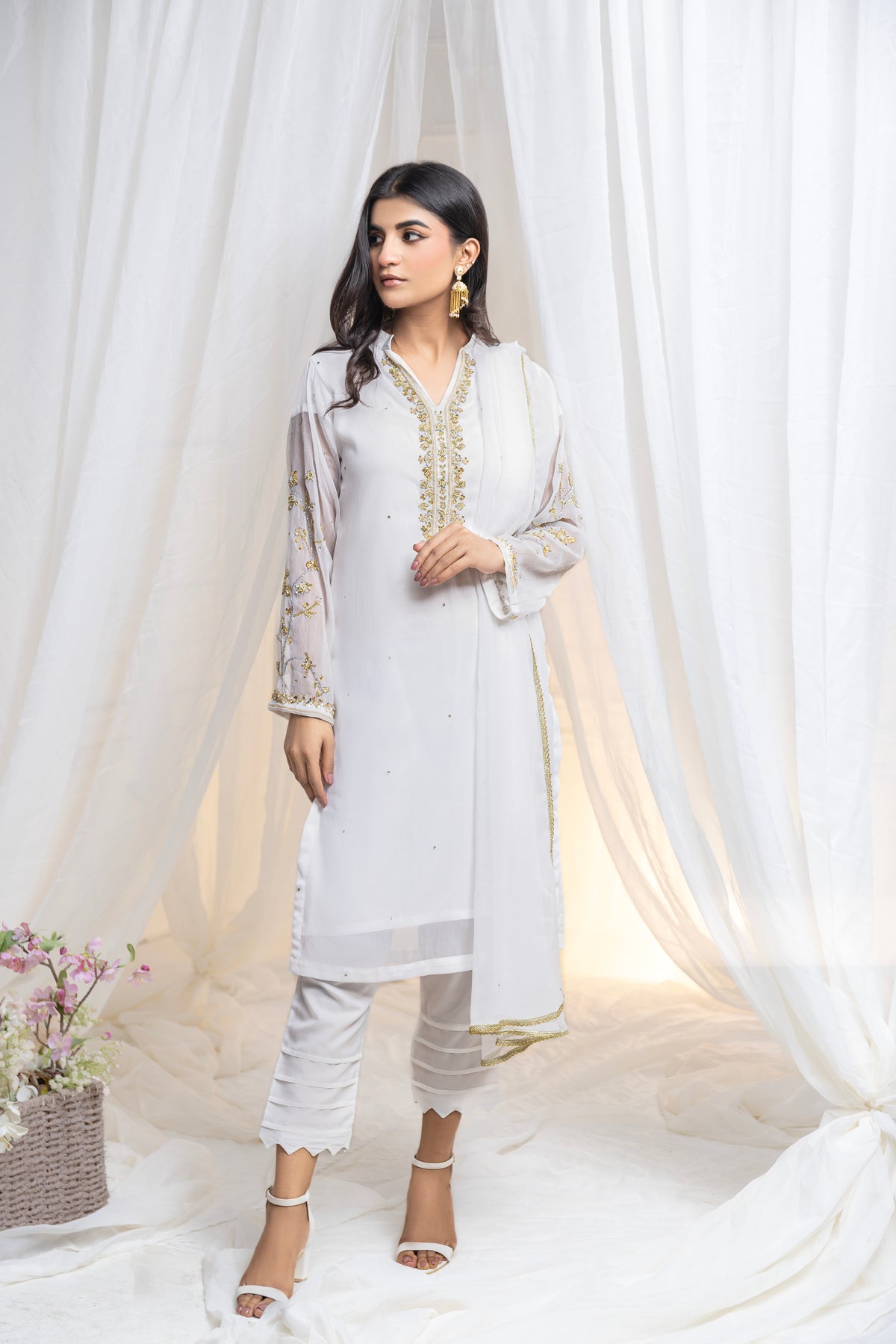 Untouched elegance: Hand-embroidered white chiffon, a canvas of pure sophistication.