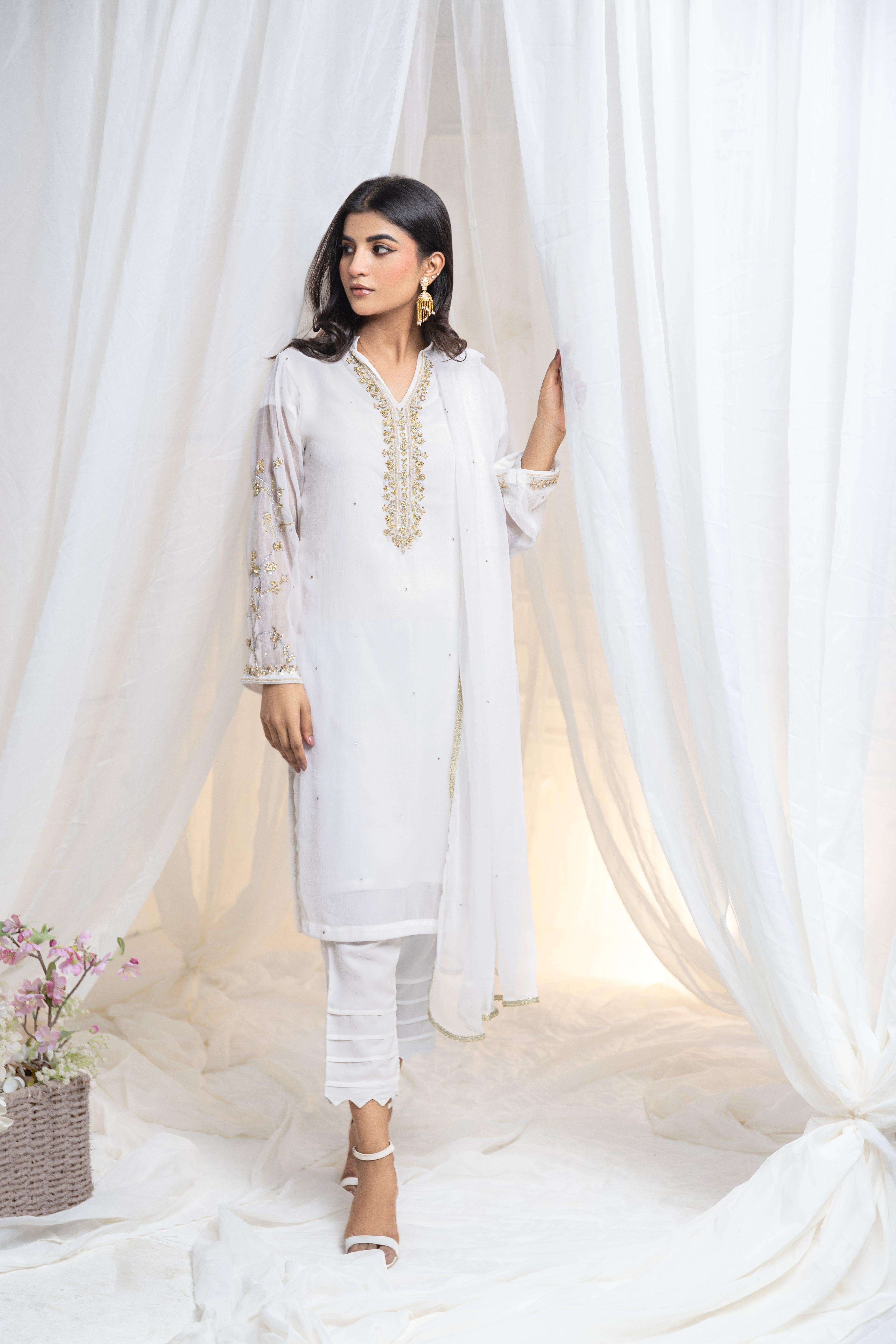 Untouched elegance: Hand-embroidered white chiffon, a canvas of pure sophistication.