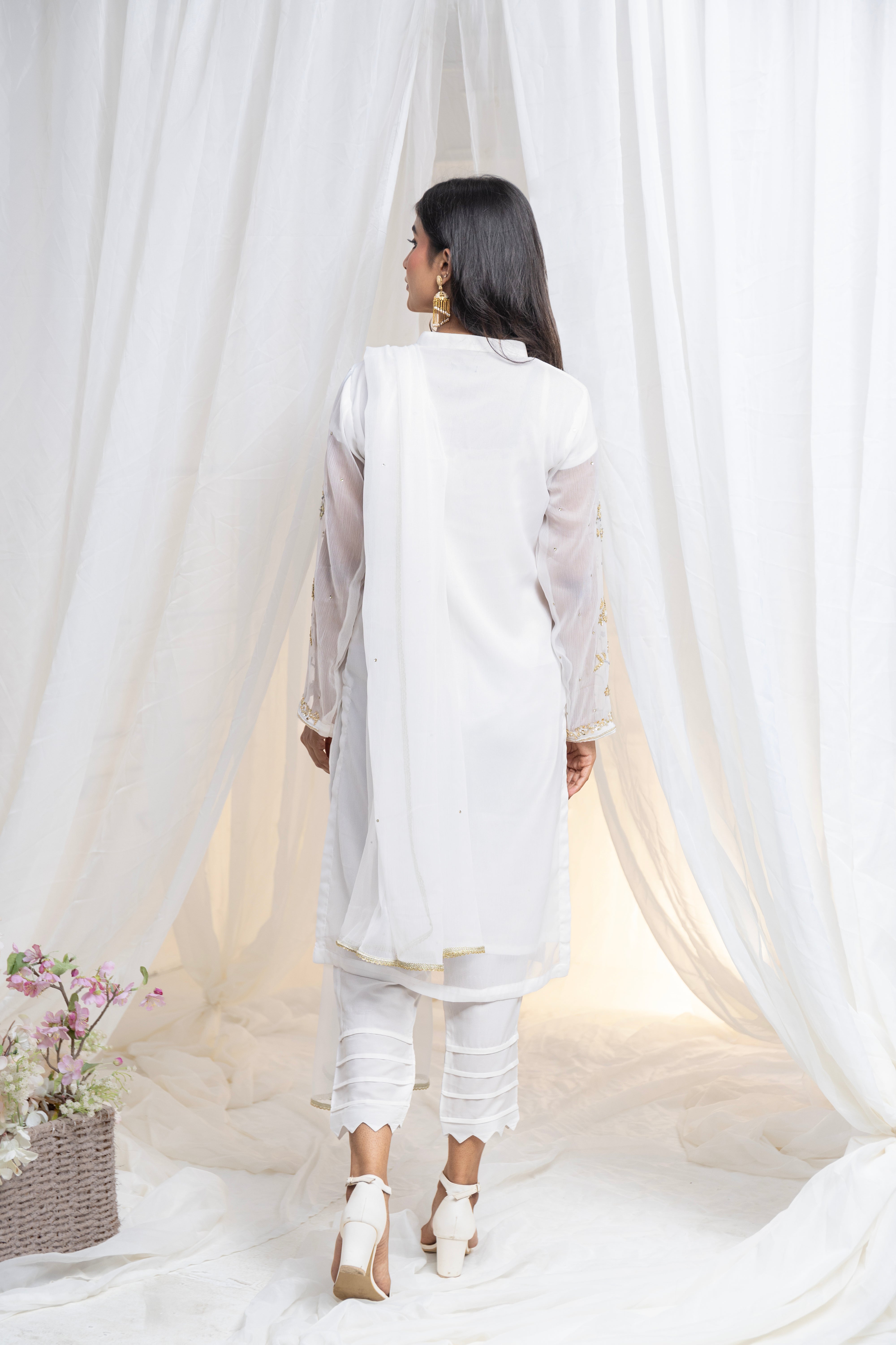 Untouched elegance: Hand-embroidered white chiffon, a canvas of pure sophistication.
